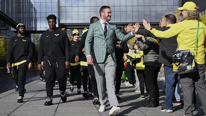 Oct 4, 2024; Eugene, Oregon, USA; Oregon Ducks head coach Dan Lanning high-fives fans before a game against the Michigan State Spartans at Autzen Stadium. Mandatory Credit: Troy Wayrynen-Imagn Images