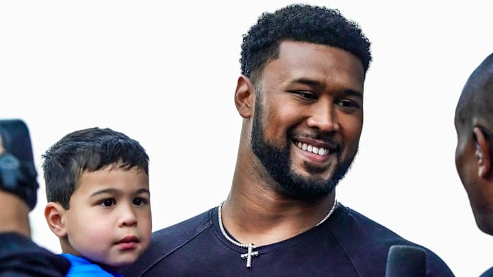 May 25, 2025; Indianapolis, Indiana, USA; Indianapolis Colts player DeForest Buckner and his children walk the red carpet on Sunday, May 25, 2025, ahead of the 109th running of the Indianapolis 500 at Indianapolis Motor Speedway. 