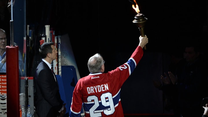 Oct 16, 2014; Montreal, Quebec, CAN; Canadiens former goalie Ken Dryden brings the torch before the game between the Boston Bruins and the Montreal Canadiens at the Bell Centre. Mandatory Credit: Eric Bolte-Imagn Images