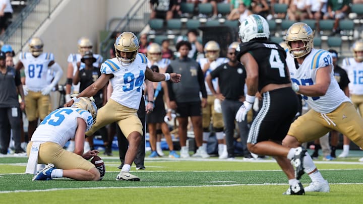 Aug 31, 2024; Honolulu, Hawaii, USA; UCLA Bruins place kicker Mateen Bhaghani (94) makes a field goal against the Hawaii Rainbow Warriors during the third quarter of an NCAA college football game against the UCLA Bruins at the Clarence T.C. Ching Athletics Complex. Mandatory Credit: Marco Garcia-Imagn Images Aug 31, 2024; Honolulu, Hawaii, USA; UCLA Bruins place kicker Mateen Bhaghani (94) makes a field goal against the Hawaii Rainbow Warriors during the third quarter of an NCAA college football game against the UCLA Bruins at the Clarence T.C. Ching Athletics Complex. Mandatory Credit: Marco Garcia-Imagn Images