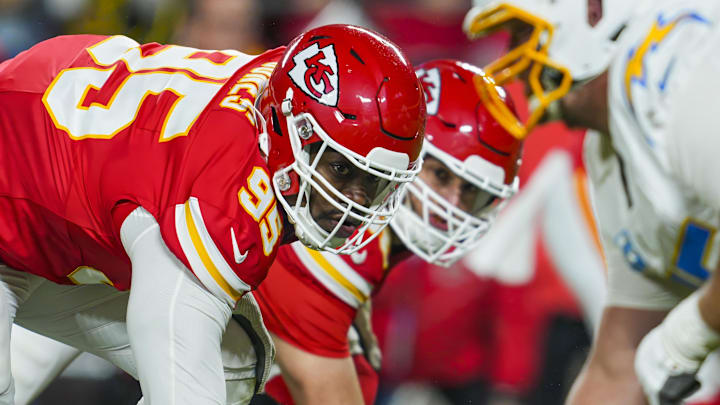 Dec 8, 2024; Kansas City, Missouri, USA; Kansas City Chiefs defensive tackle Chris Jones (95) and defensive end George Karlaftis (56) get ready before the snap during the first half against the Los Angeles Chargers at GEHA Field at Arrowhead Stadium. Mandatory Credit: Jay Biggerstaff-Imagn Images