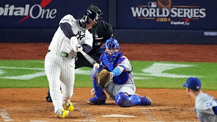 Oct 30, 2024; New York, New York, USA; New York Yankees outfielder Alex Verdugo (24) hits an RBI single during the second inning against the Los Angeles Dodgers in game four of the 2024 MLB World Series at Yankee Stadium. 