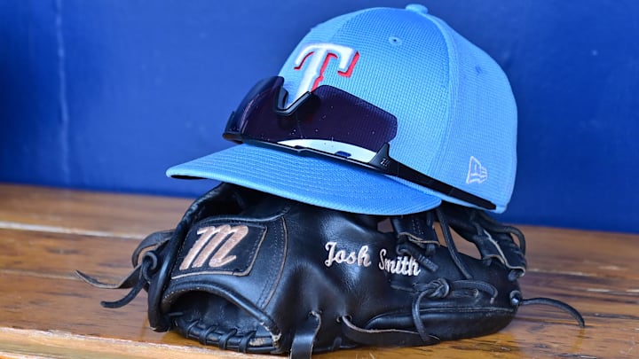 Mar 15, 2024; Salt River Pima-Maricopa, Arizona, USA; General view of a Texas Rangers hat, glove, and glasses prior to a spring training game against the Colorado Rockies at Salt River Fields at Talking Stick.