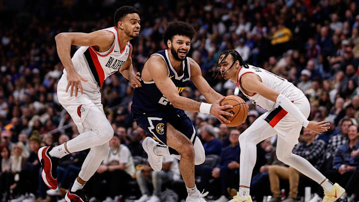 Feb 12, 2025; Denver, Colorado, USA; Denver Nuggets guard Jamal Murray (27) controls the ball under pressure from Portland Trail Blazers guard Rayan Rupert (21) and guard Dalano Banton (5) in the third quarter at Ball Arena. Mandatory Credit: Isaiah J. Downing-Imagn Images Feb 12, 2025; Denver, Colorado, USA; Denver Nuggets guard Jamal Murray (27) controls the ball under pressure from Portland Trail Blazers guard Rayan Rupert (21) and guard Dalano Banton (5) in the third quarter at Ball Arena. Mandatory Credit: Isaiah J. Downing-Imagn Images