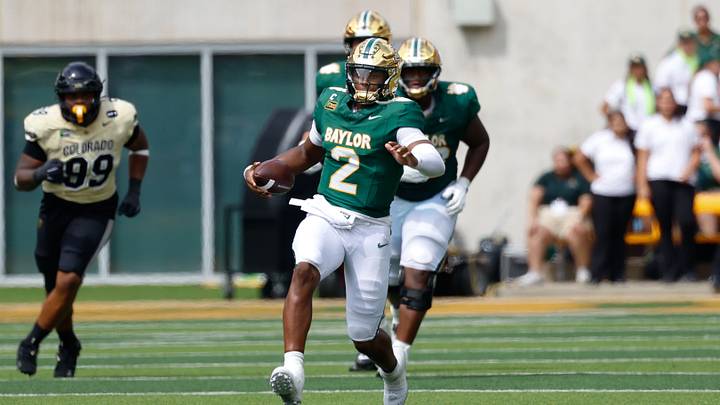 Sep 26, 2026; Waco, Texas, USA; Baylor Bears quarterback DJ Lagway (2) carries the ball for a six yard gain against the Colorado Buffaloes during the second half at McLane Stadium. Mandatory Credit: Chris Jones Sep 26, 2026; Waco, Texas, USA; Baylor Bears quarterback DJ Lagway (2) carries the ball for a six yard gain against the Colorado Buffaloes during the second half at McLane Stadium. Mandatory Credit: Chris Jones