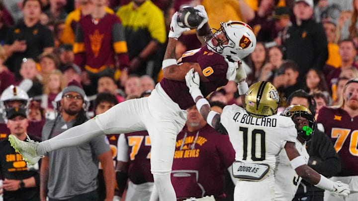 ASU wide receiver Jordyn Tyson (0) catches a ball on the sideline against UCF defensive back Quadric Bullard (10) during a game at Mountain America Stadium in Tempe on Nov. 9, 2024. ASU wide receiver Jordyn Tyson (0) catches a ball on the sideline against UCF defensive back Quadric Bullard (10) during a game at Mountain America Stadium in Tempe on Nov. 9, 2024.