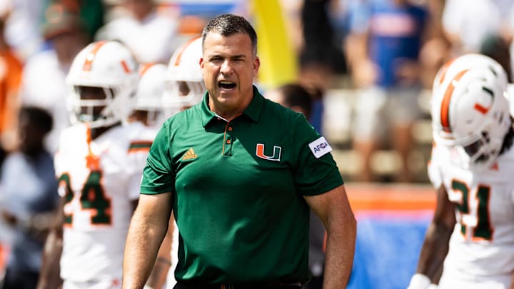 Aug 31, 2024; Gainesville, Florida, USA; Miami Hurricanes head coach Mario Cristobal reacts before a game against the Florida Gators at Ben Hill Griffin Stadium. Mandatory Credit: Matt Pendleton-Imagn Images Aug 31, 2024; Gainesville, Florida, USA; Miami Hurricanes head coach Mario Cristobal reacts before a game against the Florida Gators at Ben Hill Griffin Stadium. Mandatory Credit: Matt Pendleton-Imagn Images