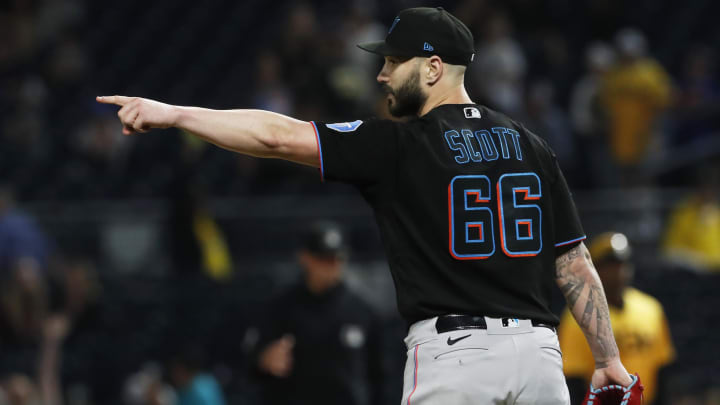 Sep 29, 2023; Pittsburgh, Pennsylvania, USA;  Miami Marlins relief pitcher Tanner Scott (66) reacts after the final out to defeat the Pittsburgh Pirates during the ninth inning at PNC Park. Miami won 4-3