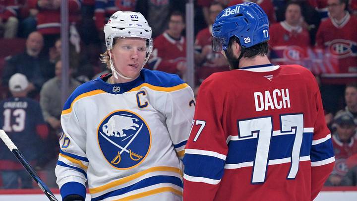 May 10, 2026; Montreal, Quebec, CAN; Buffalo Sabres defenseman Rasmus Dahlin (26) and Montreal Canadiens forward Kirby Dach (77) exchange words during the second period in game three of the second round of the 2026 Stanley Cup Playoffs at the Bell Centre. Mandatory Credit: Eric Bolte-Imagn Images