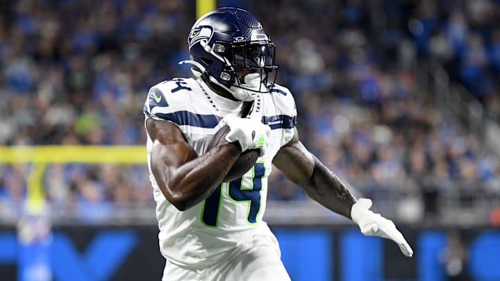 Sep 30, 2024; Detroit, Michigan, USA; Seattle Seahawks wide receiver DK Metcalf (14) runs with the ball against the Detroit Lions in the second quarter at Ford Field. Mandatory Credit: Eamon Horwedel-Imagn Images
