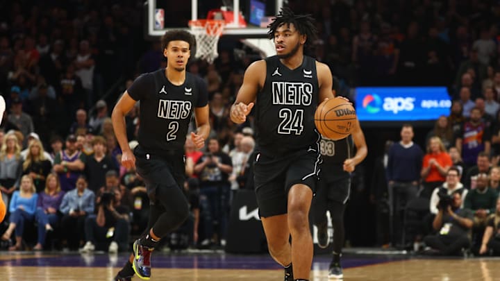 Dec 13, 2023; Phoenix, Arizona, USA; Brooklyn Nets guard Cam Thomas (24) and forward Cameron Johnson