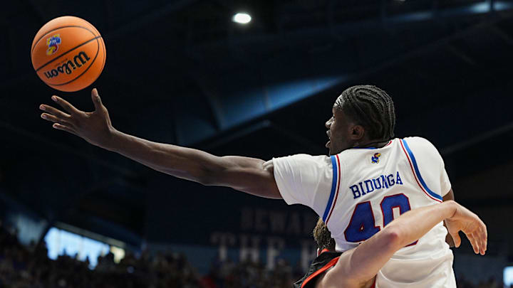 Nov 15, 2025; Lawrence, Kansas, USA; Kansas Jayhawks forward Flory Bidunga (40) grabs a rebound over Princeton Tigers guard Jackson Hicke (33) during the first half at Allen Fieldhouse.