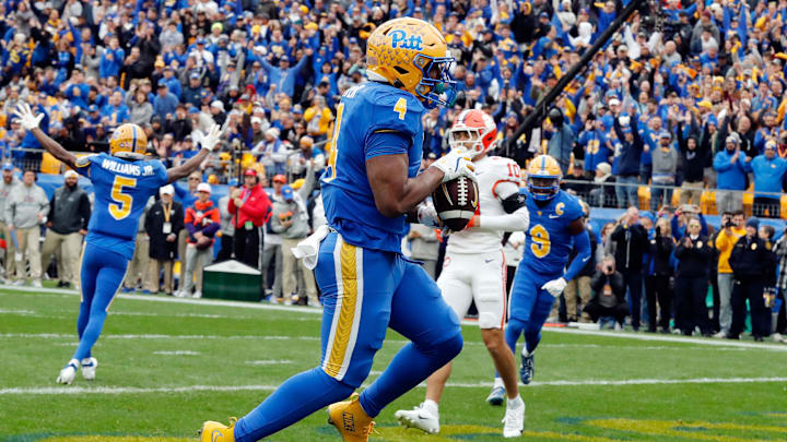 Nov 16, 2024; Pittsburgh, Pennsylvania, USA;  Pittsburgh Panthers running back Daniel Carter (4) scores a touchdown against the Clemson Tigers during the first quarter at Acrisure Stadium. Mandatory Credit: Charles LeClaire-Imagn Images