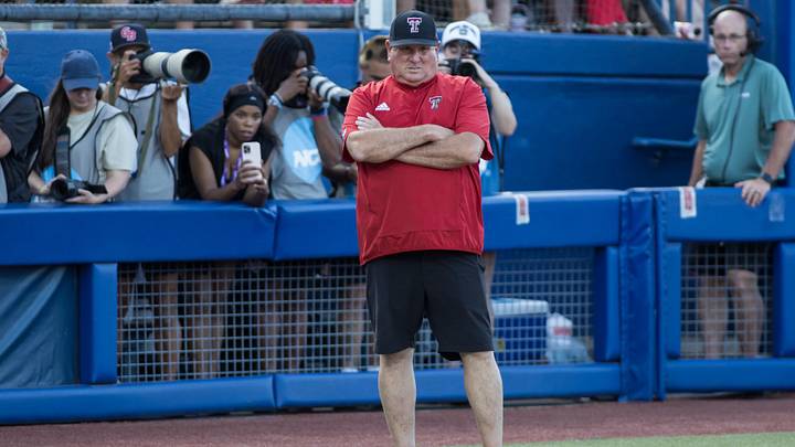 Texas Tech Red Raiders head coach Gerry Glasco watches game play in the fourth inning against the Texas Longhorns during Game Two of the NCAA Women’s College World Series championship series at Devon Park. Texas Tech Red Raiders head coach Gerry Glasco watches game play in the fourth inning against the Texas Longhorns during Game Two of the NCAA Women’s College World Series championship series at Devon Park.