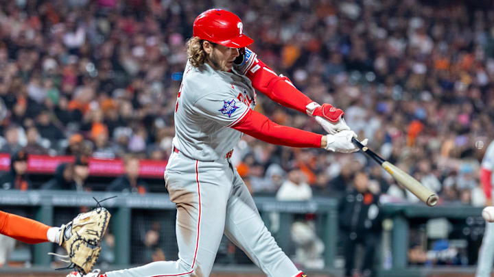 Apr 6, 2026; San Francisco, California, USA; Philadelphia Phillies third baseman Alec Bohm (28) doubles during the seventh inning against the San Francisco Giants at Oracle Park. 