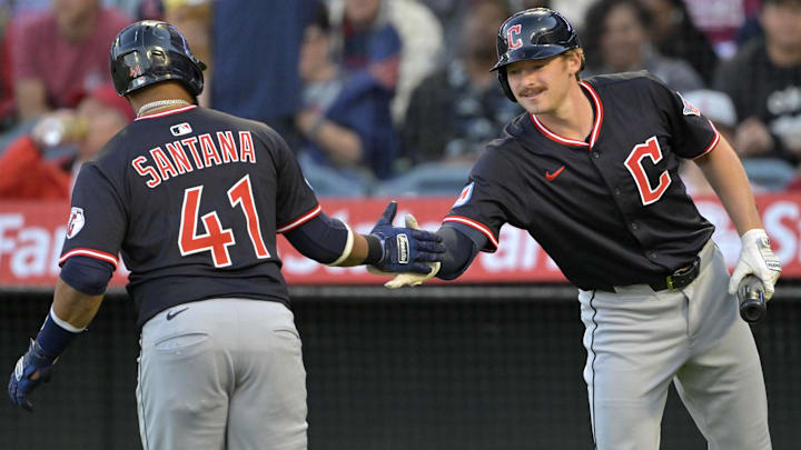 Apr 5, 2025; Anaheim, California, USA;  Cleveland Guardians first baseman Carlos Santana (41) is congratulated by  designated hitter Kyle Manzardo (9) after hitting a solo home run in the first inning against the Los Angeles Angels at Angel Stadium. Mandatory Credit: Jayne Kamin-Oncea-Imagn Images