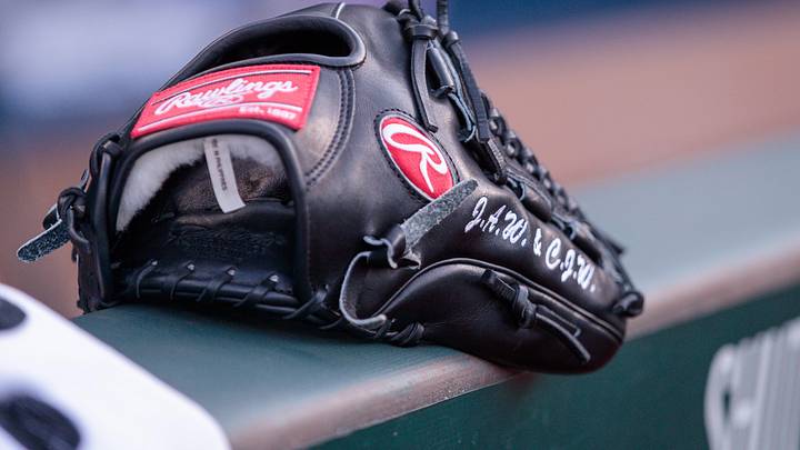 Jun 28, 2023; Kansas City, Missouri, USA; Glove sits on the dugout wall prior to the game between the Cleveland Guardians and the Kansas City Royals at Kauffman Stadium. Mandatory Credit: William Purnell-Imagn Images