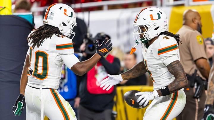 Jan 19, 2026; Miami Gardens, FL, USA; Miami Hurricanes running back Mark Fletcher Jr. (4) celebrates a touchdown with wide receiver Malachi Toney (10) against the Indiana Hoosiers during the College Football Playoff National Championship game at Hard Rock Stadium. Mandatory Credit: Mark J. Rebilas-Imagn Images