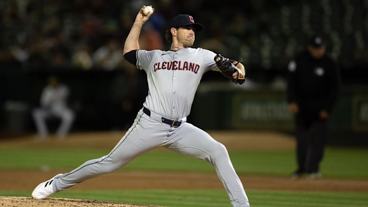 Mar 28, 2024; Oakland, California, USA; Cleveland Guardians starting pitcher Shane Bieber (57) delivers a pitch against the Oakland Athletics during the third inning at Oakland-Alameda County Coliseum.