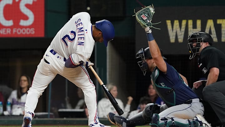 May 3, 2025; Arlington, Texas, USA; Texas Rangers second baseman Marcus Semien (2) gets out of the way of an inside pitch during the ninth inning against the Seattle Mariners at Globe Life Field. Mandatory Credit: Raymond Carlin III-Imagn Images