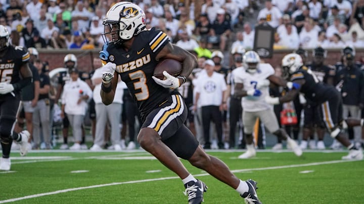 Sep 9, 2023; Columbia, Missouri, USA; Missouri Tigers wide receiver Luther Burden III (3) runs the ball against the Middle Tennessee Blue Raiders during the game at Faurot Field at Memorial Stadium. Mandatory Credit: Denny Medley-Imagn Images