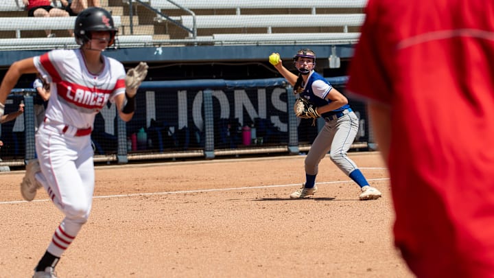 Neshannock's Katherine DiMuccio attempts to outrun Conwell-Egan's Cecelia McBeth's throw to first base in the PIAA 2A softball championship game in 2022. The Lancers' 57-game win streak, which began in the 2024 season, was snapped on Thursday, April 9 (2026) in a loss to Shenango.