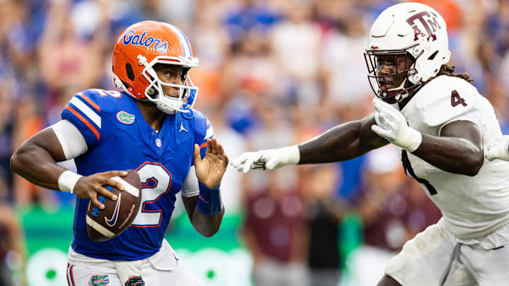 Sep 14, 2024; Gainesville, Florida, USA; Florida Gators quarterback DJ Lagway (2) evades Texas A&M Aggies defensive lineman Shemar Stewart (4) during the first half at Ben Hill Griffin Stadium. Mandatory Credit: Matt Pendleton-Imagn Images