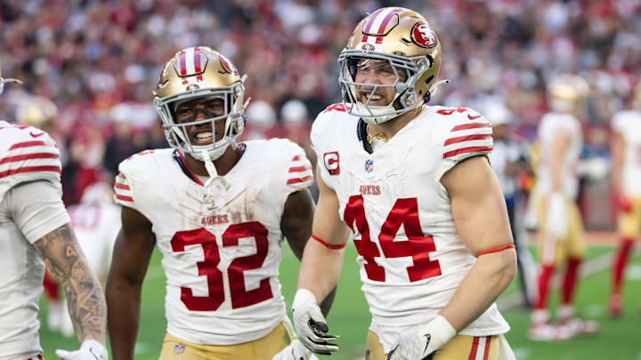 Jan 5, 2025; Glendale, Arizona, USA; San Francisco 49ers running back Patrick Taylor Jr. (32) and fullback Kyle Juszczyk (44) celebrate a touchdown against the Arizona Cardinals at State Farm Stadium.