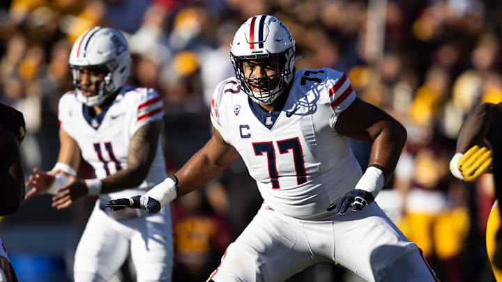 Nov 25, 2023; Tempe, Arizona, USA; Arizona Wildcats offensive lineman Jordan Morgan (77) against the Arizona State Sun Devils during the Territorial Cup at Mountain America Stadium. Mandatory Credit: Mark J. Rebilas-Imagn Images
