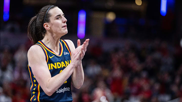 Jun 14, 2025; Indianapolis, Indiana, USA; Indiana Fever guard Caitlin Clark celebrates a made basket in the second half against the New York Liberty / Trevor Ruszkowski-Imagn Images