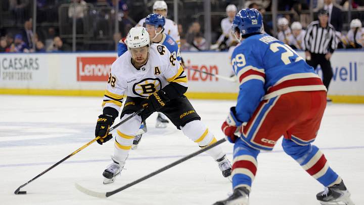 Jan 26, 2026; New York, New York, USA; Boston Bruins right wing David Pastrnak (88) skates with the puck against New York Rangers defenseman Matthew Robertson (29) during the first period at Madison Square Garden. Mandatory Credit: Brad Penner-Imagn Images Jan 26, 2026; New York, New York, USA; Boston Bruins right wing David Pastrnak (88) skates with the puck against New York Rangers defenseman Matthew Robertson (29) during the first period at Madison Square Garden. Mandatory Credit: Brad Penner-Imagn Images
