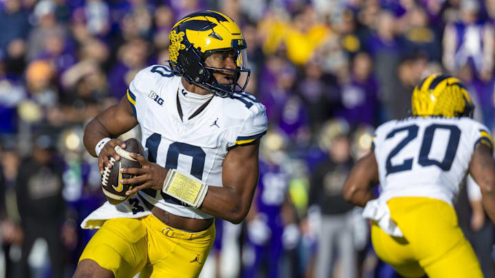 Former Michigan Wolverines quarterback Alex Orji (10) looks to pass against the Washington Huskies during the first quarter at Alaska Airlines Field at Husky Stadium. 