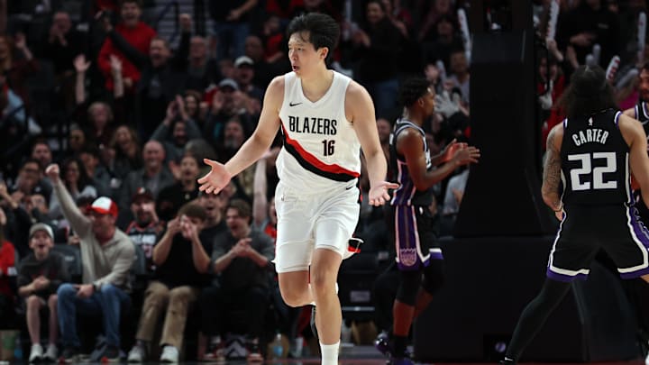 Oct 10, 2025; Portland, Oregon, USA: Portland Trail Blazers center Yang Hansen  (16) reacts after not getting a foul against Sacramento Kings in the second half at Moda Center. Mandatory Credit: Jaime Valdez-Imagn Images