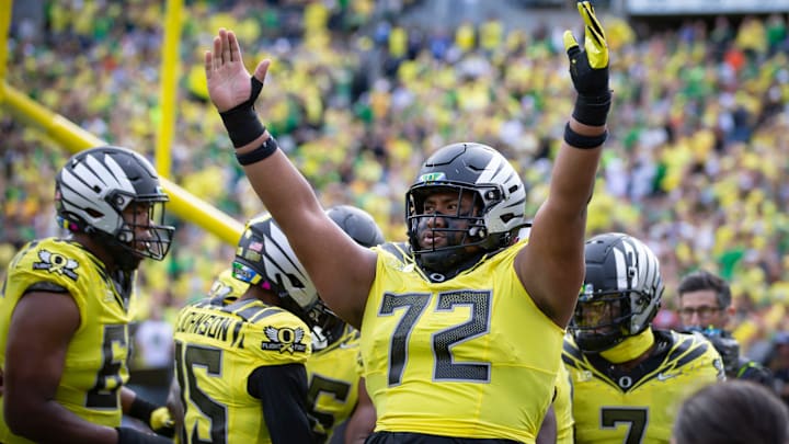 Oregon offensive lineman Iapani Laloulu celebrates a touchdown by Oregon running back Noah Whittington as the No. 1 Oregon Ducks host the No. 21 Illinois Fighting Illini Saturday, Oct. 26, 2024 at Autzen Stadium in Eugene, Ore.
