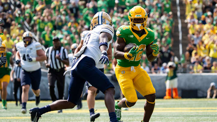 Oregon running back Jay Harris runs the ball against Montana State defensive back Takhari Carr as the Oregon Ducks host the Montana State Bobcats on Aug. 30, 2025, at Autzen Stadium in Eugene, Oregon.