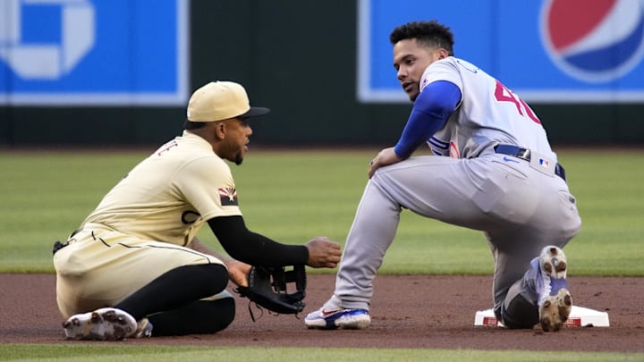 May 13, 2022; Phoenix, Arizona, USA; Chicago Cubs catcher Willson Contreras (40) reacts after getting tagged out by Arizona Diamondbacks second baseman Ketel Marte (4) trying to steal second base in the first inning at Chase Field. Mandatory Credit: Rick Scuteri-Imagn Images