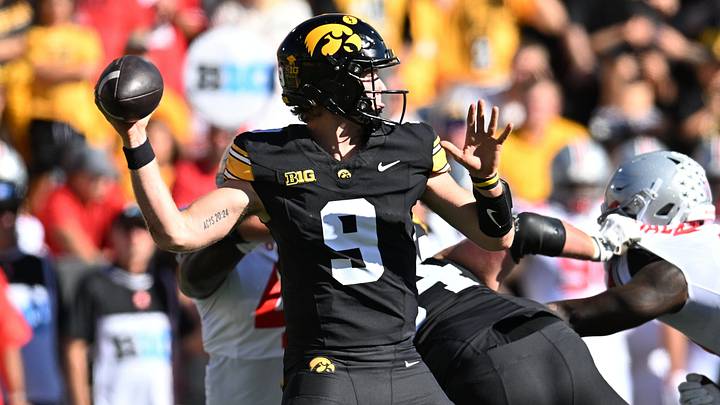 Oct 3, 2026; Iowa City, Iowa, USA;  Iowa Hawkeyes quarterback Hank Brown (9) passes against the Ohio State Buckeyes during the first half at Kinnick Stadium.  Mandatory Credit: Jeffrey Becker-Imagn Images