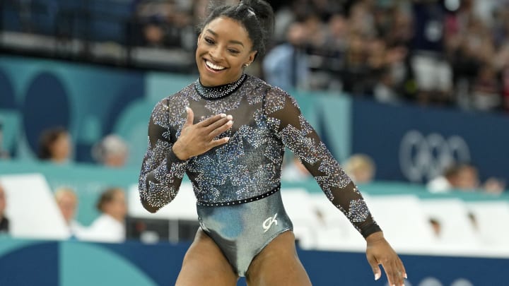 Jul 28, 2024; Paris, France; Simone Biles of the United States reacts after performing on the beam in womenís qualification during the Paris 2024 Olympic Summer Games at Bercy Arena. Jul 28, 2024; Paris, France; Simone Biles of the United States reacts after performing on the beam in womenís qualification during the Paris 2024 Olympic Summer Games at Bercy Arena.