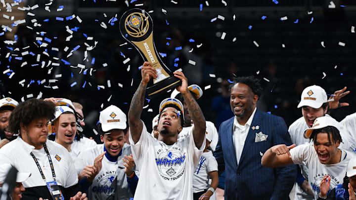 Seton Hall Pirates guard Al-Amir Dawes  celebrates with the trophy after defeating the Indiana State Sycamores at Hinkle Fieldhouse. 