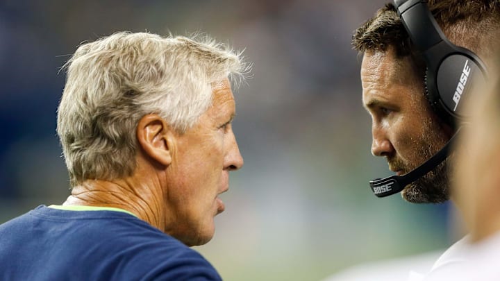 Seattle Seahawks coach Pete Carroll talks with offensive coordinator Brian Schottenheimer during a game against the Indianapolis Colts.