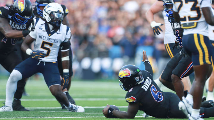 Kansas Jayhawks quarterback Jalon Daniels (6) questions officials after a running play during the first half of the game against West Virginia Mountaineers at David Booth Kansas Memorial Stadium on Sept. 20, 2025.