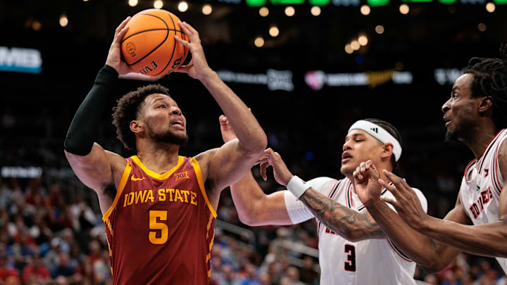 Mar 12, 2026; Kansas City, MO, USA; Iowa State Cyclones forward Joshua Jefferson (5) drives to the basket around Texas Tech Red Raiders forward LeJuan Watts (3) during the second half at T-Mobile Center. 