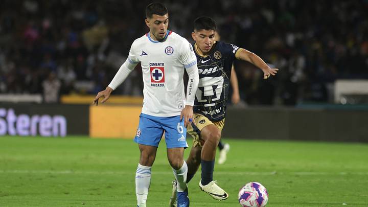 Erik Lira #6 of Cruz Azul and Piero Quispe #27 of Pumas Erik Lira #6 of Cruz Azul and Piero Quispe #27 of Pumas
