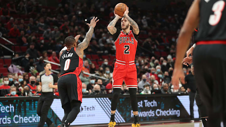 Nov 17, 2021; Portland, Oregon, USA: Chicago Bulls guard Lonzo Ball (2) shoots over Portland Trail Blazers guard Damian Lillard (0) in the first half at Moda Center. Mandatory Credit: Jaime Valdez-Imagn Images Nov 17, 2021; Portland, Oregon, USA: Chicago Bulls guard Lonzo Ball (2) shoots over Portland Trail Blazers guard Damian Lillard (0) in the first half at Moda Center. Mandatory Credit: Jaime Valdez-Imagn Images