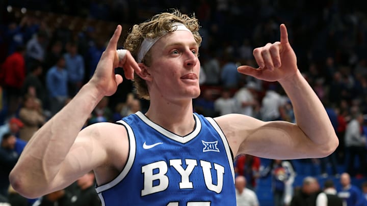 Richie Saunders celebrates with fans following BYU's win over Kansas