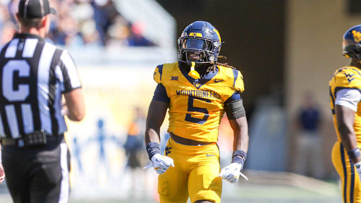 Aug 30, 2025; Morgantown, West Virginia, USA; West Virginia Mountaineers safety Fred Perry (5) celebrates after a tackle for loss during the second quarter against the Robert Morris Colonials at Milan Puskar Stadium. Mandatory Credit: Ben Queen-Imagn Images Aug 30, 2025; Morgantown, West Virginia, USA; West Virginia Mountaineers safety Fred Perry (5) celebrates after a tackle for loss during the second quarter against the Robert Morris Colonials at Milan Puskar Stadium. Mandatory Credit: Ben Queen-Imagn Images