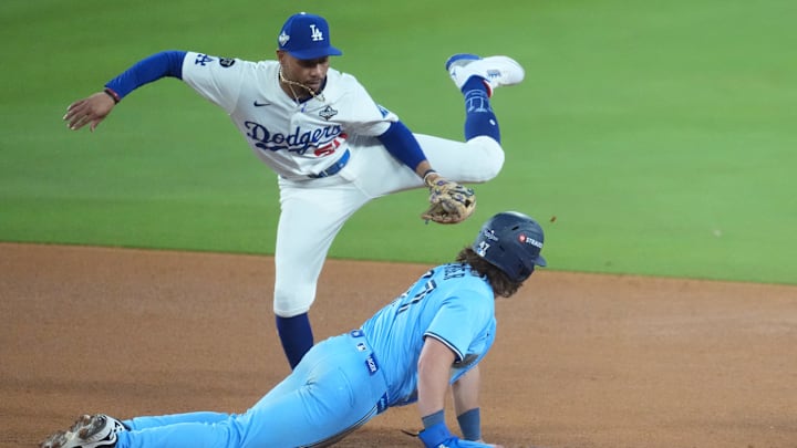 Oct 29, 2025; Los Angeles, California, USA; Toronto Blue Jays third baseman Addison Barger (47) is safe at second against Los Angeles Dodgers shortstop Mookie Betts (50) in the seventh inning during game five of the 2025 MLB World Series at Dodger Stadium. Mandatory Credit: Kirby Lee-Imagn Images