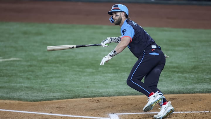 Jul 16, 2024; Arlington, Texas, USA; National League first baseman Bryce Harper of the Philadelphia Phillies (3) hits the ball during the first inning during the 2024 MLB All-Star game at Globe Life Field. 