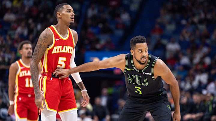 Nov 4, 2023; New Orleans, Louisiana, USA; New Orleans Pelicans guard CJ McCollum (3) guards Atlanta Hawks guard Dejounte Murray (5) during the first half at Smoothie King Center.