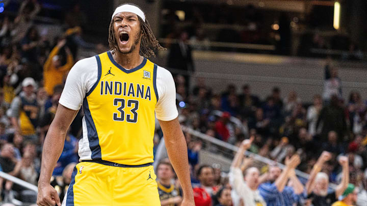 Nov 10, 2024; Indianapolis, Indiana, USA; Indiana Pacers center Myles Turner (33)  celebrates a made basket in the  second half against the New York Knicks at Gainbridge Fieldhouse. Mandatory Credit: Trevor Ruszkowski-Imagn Images